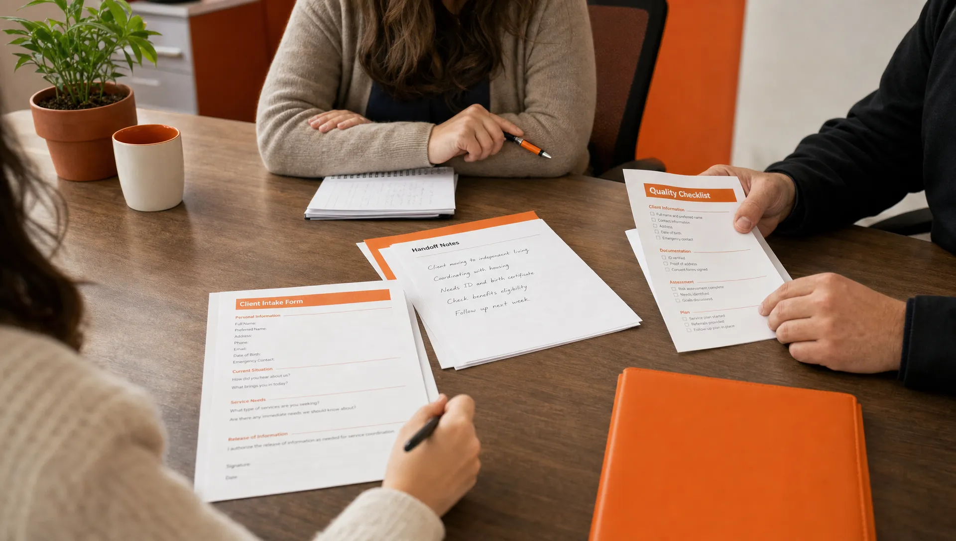 Printed intake forms, handoff notes and a quality checklist sit across a conference table as a real agency workflow test.
