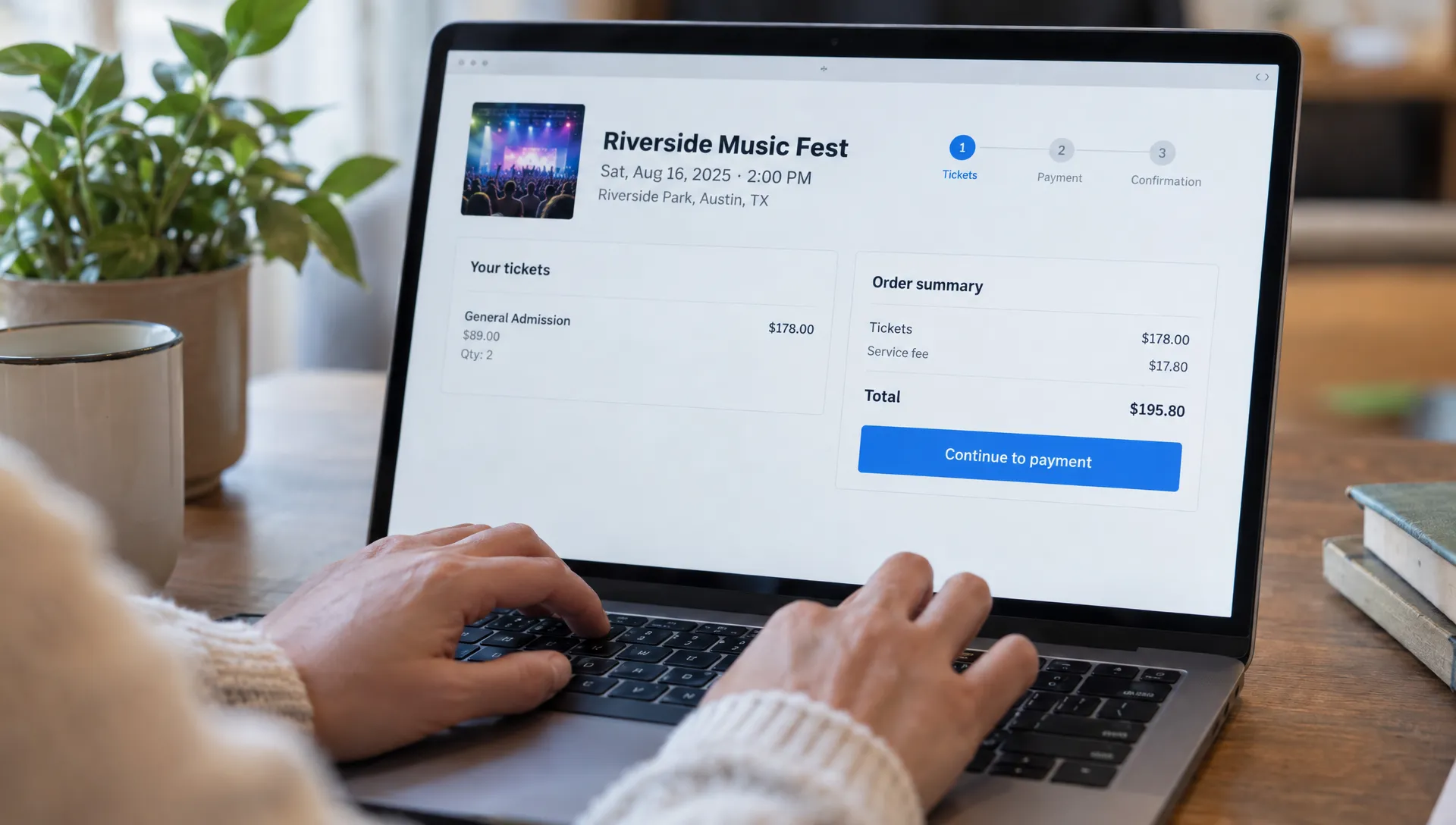 An attendee's hands use a laptop keyboard to reach the focused “Continue to payment” button in an event ticket checkout, with the screen facing the viewer.