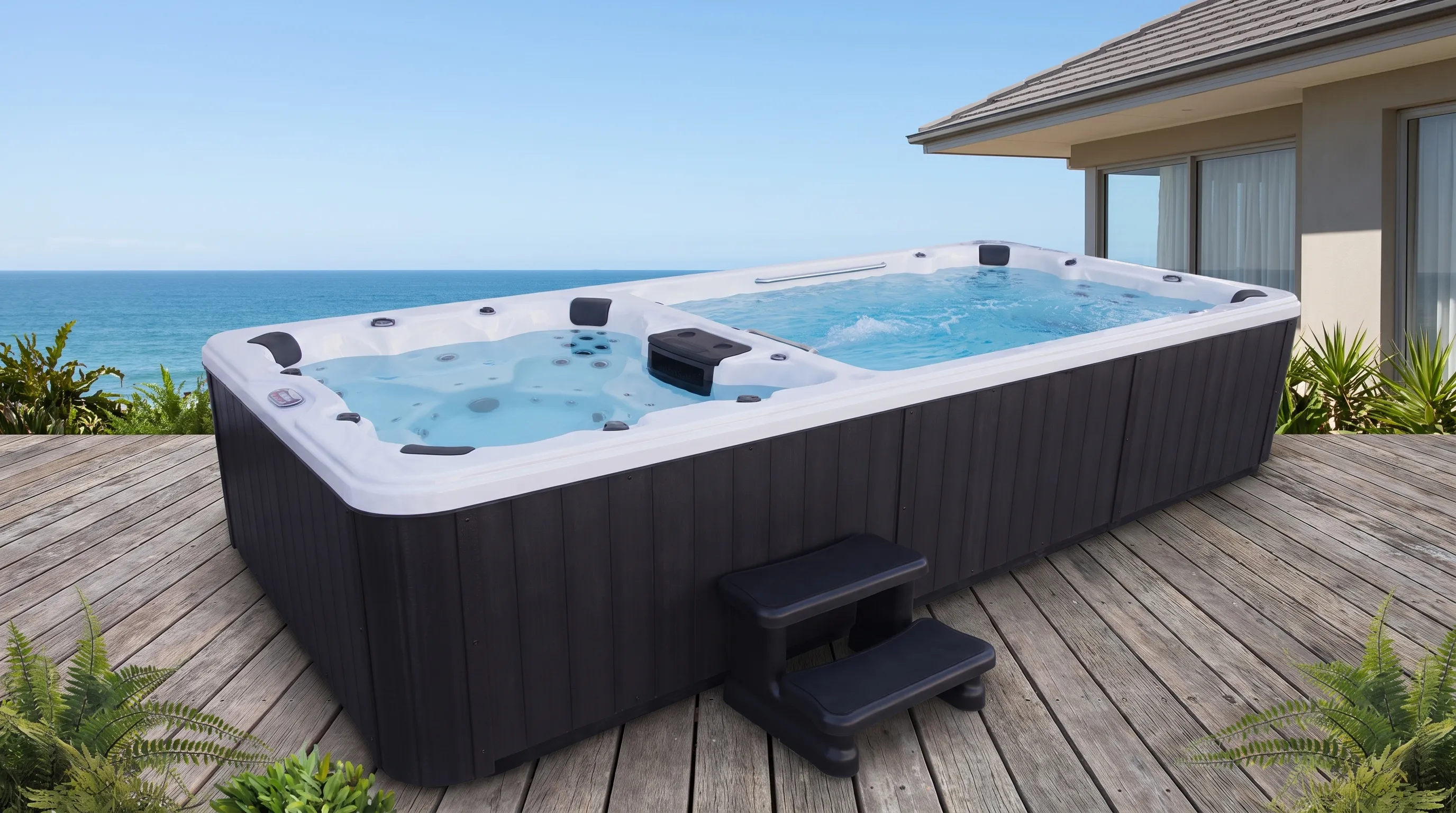 Backyard dual-zone swim spa combo with separate swimming and soaking chambers, showing the steps, divider, and open access around the cabinet.