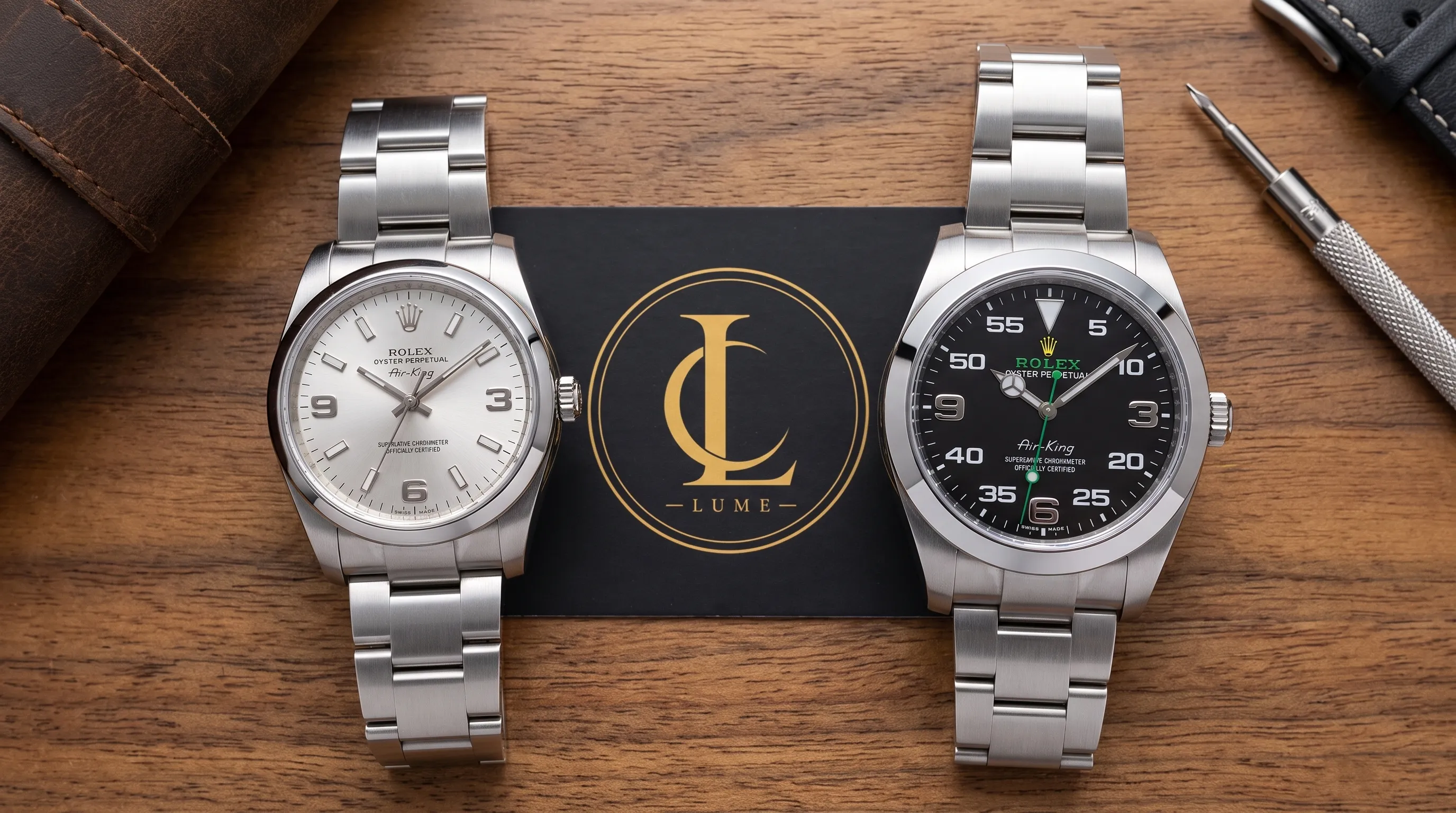A 34mm silver-dial Air-King-style watch and a 40mm black-dial example sit side by side, showing the differences in size, numerals, and case details.