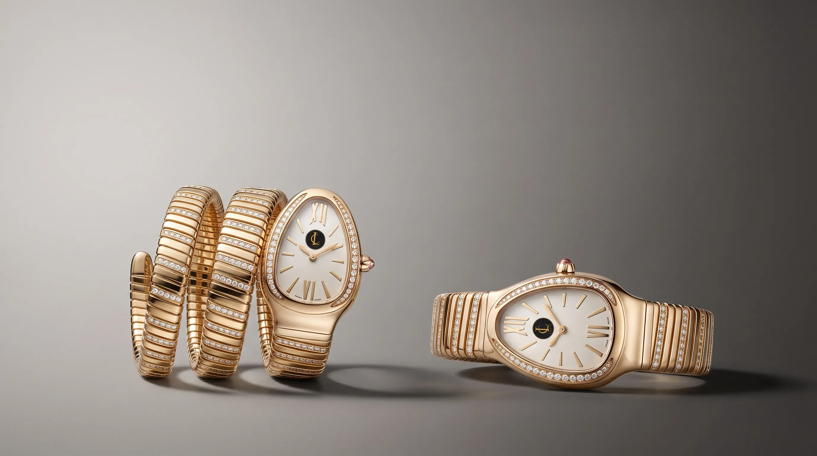 Two Serpenti-style watches arranged on a clean gradient studio backdrop, one showing a tighter coil profile and the other a flatter bracelet profile, with both cases angled toward the camera. The watches are separated by a small spacing of shadow and reflection, creating a balanced horizontal composition with clear negative space in the top-left.