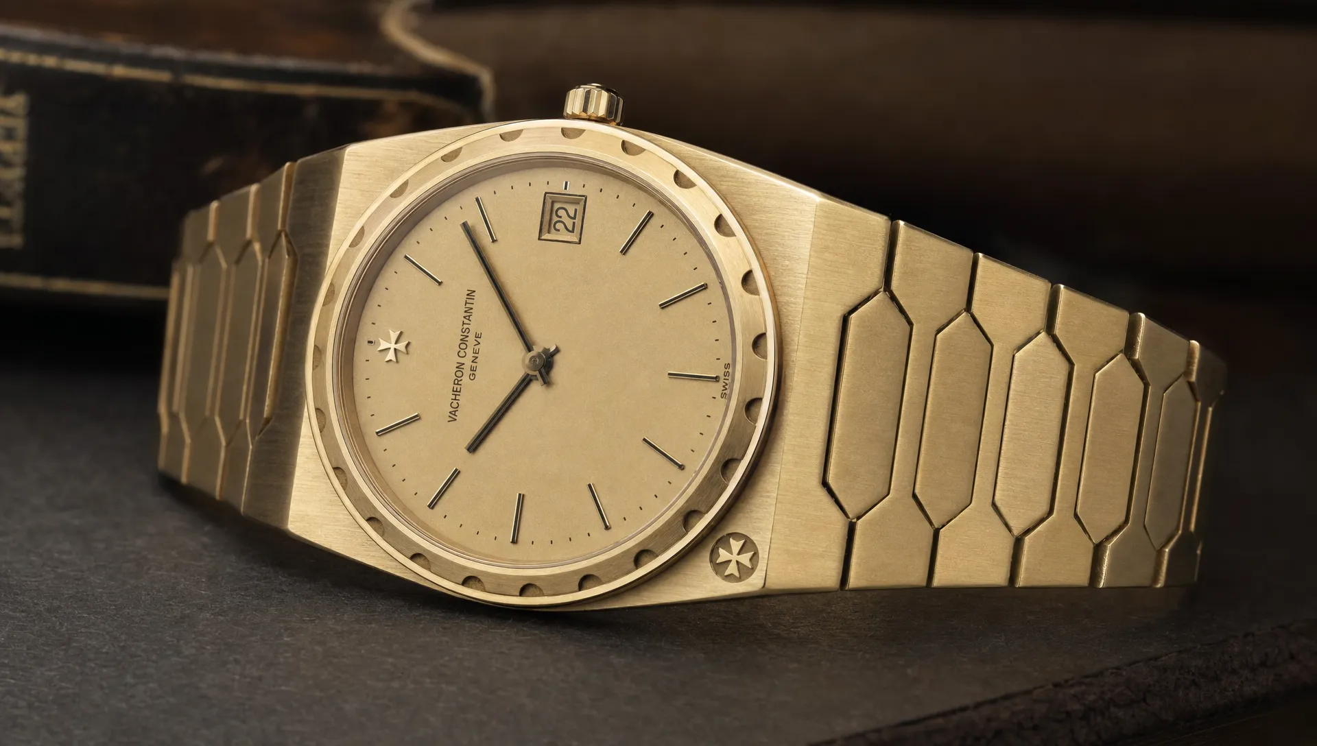 A close view of a vintage Vacheron Constantin 222 shows the tonneau case, notched bezel, slim profile and Maltese cross detail.