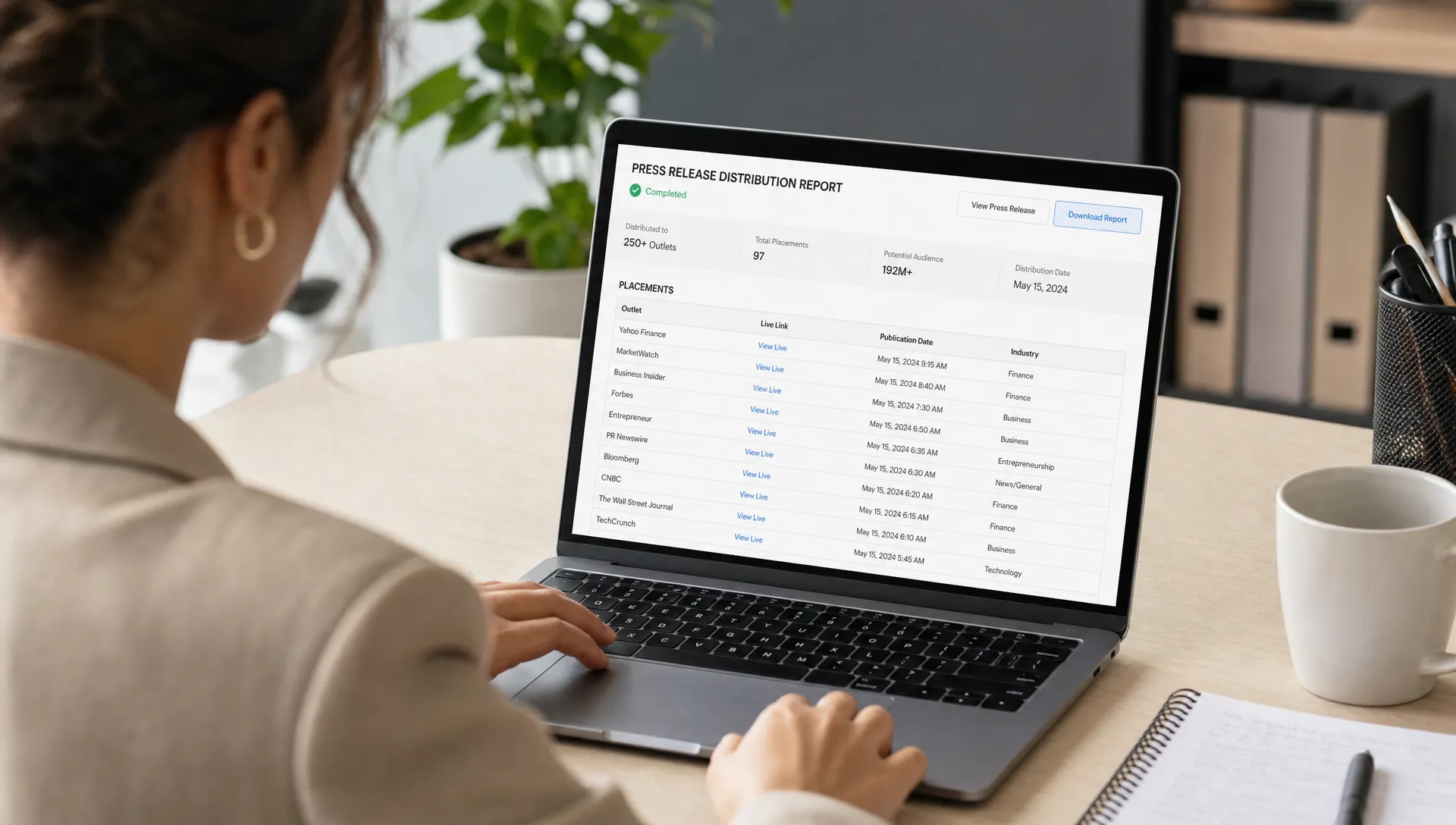 A marketing manager reviews a press release distribution proof report on a laptop screen, with outlet names, live links, publication dates and industry categories visible.