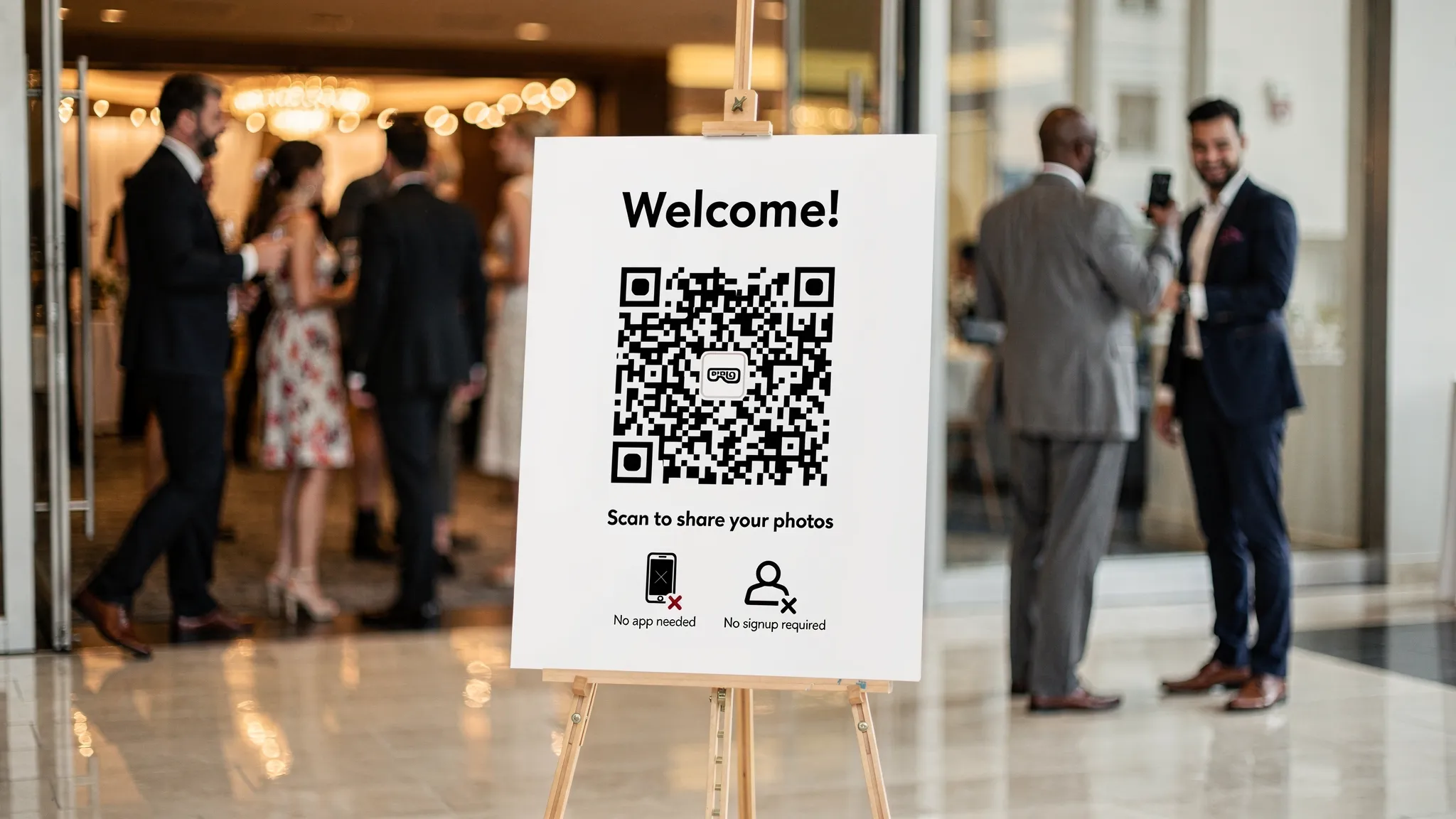 A party entrance welcome sign on an easel with a large QR code, short instructions to scan and share photos, and small icons indicating no app and no signup. Guests are walking in and pausing near the sign.