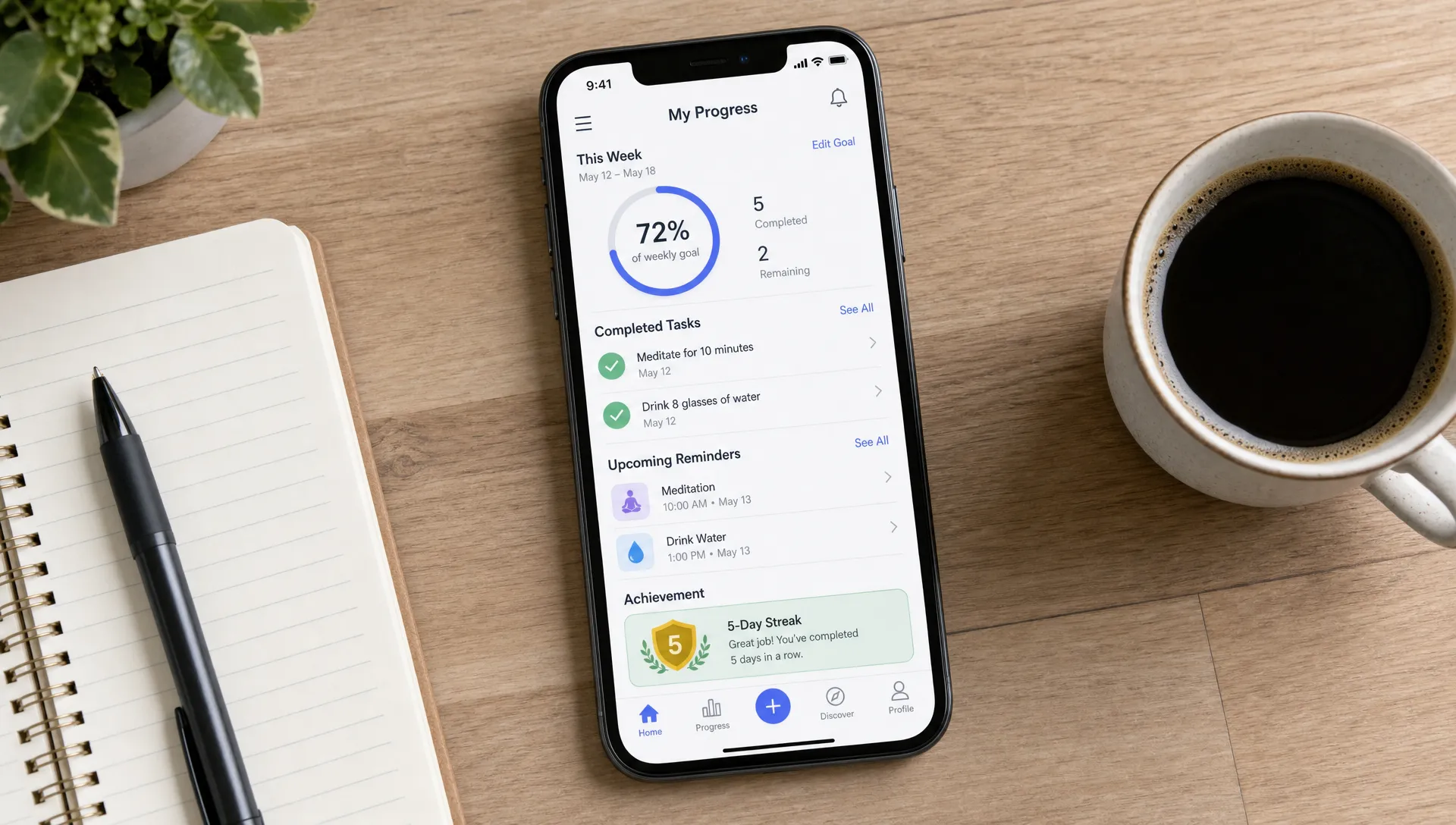 A mobile companion app interface showing weekly progress, completed tasks, upcoming reminders, and a simple achievement card on a phone beside a notebook and coffee cup, viewed from above on a desk.