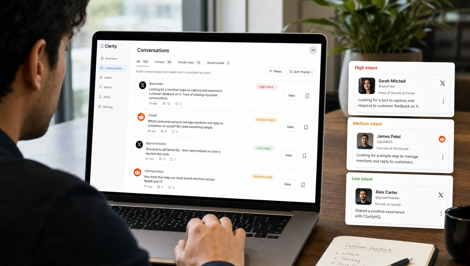 A founder reviews a prioritized inbox of public conversations from X and Reddit on a laptop, with the screen facing the camera and simple lead cards grouped by intent level beside it.