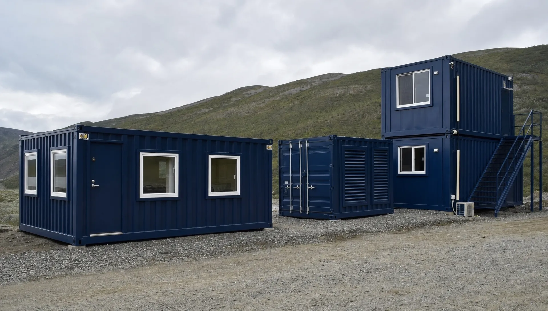 A rural worksite shows a 20ft office container with windows and a personnel door beside a vented storage container and a high cube cabin build.