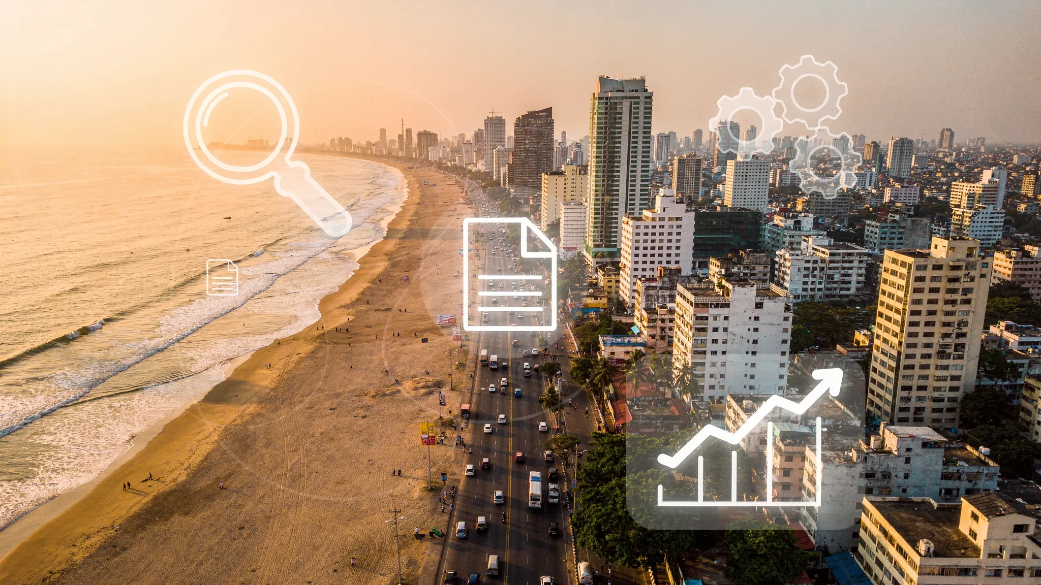 A high-angle view of Chennai&rsquo;s Marina Beach and city skyline at golden hour, with an overlay of subtle icons representing SEO activities like a magnifying glass, gears, content documents, and growth charts to symbolize a modern digital marketing ecosystem.