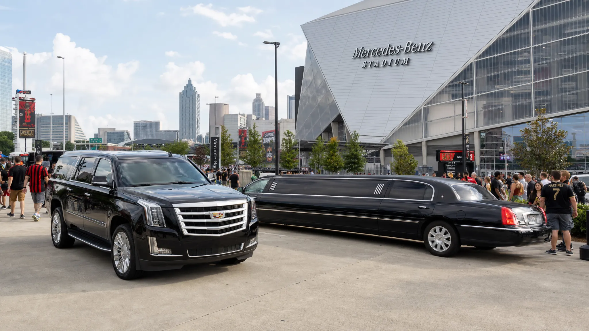 A luxury black SUV and stretch limousine staged near Mercedes-Benz Stadium on a busy international soccer matchday, with fans walking nearby and downtown Atlanta buildings in the background.