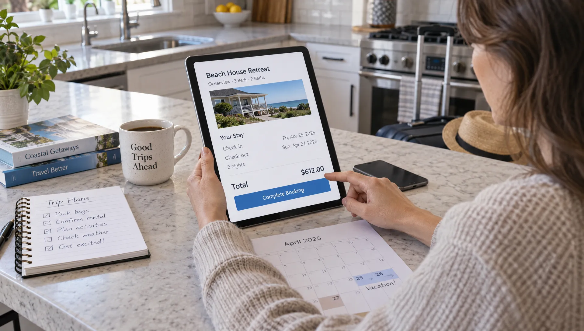 A traveler reviews a vacation home's checkout total on a tablet beside a calendar and notebook at the kitchen island.