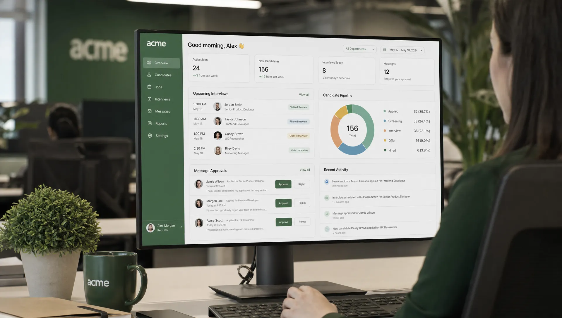 A recruiter reviews candidate profiles, interview slots, and message approvals on a clean recruitment dashboard in an office setting, with the screen facing the camera.